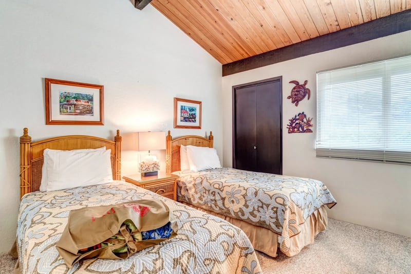 Relax in comfort with soft lighting, cozy twin beds, woven textures, and warm ceilings in this tropical retreat NAP-C42
