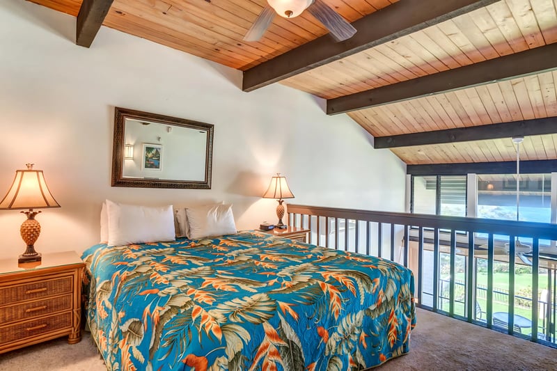 Wake up to soft light in this open-air loft bedroom with vaulted beams, lush views, and cozy island-style decor NAP-C42