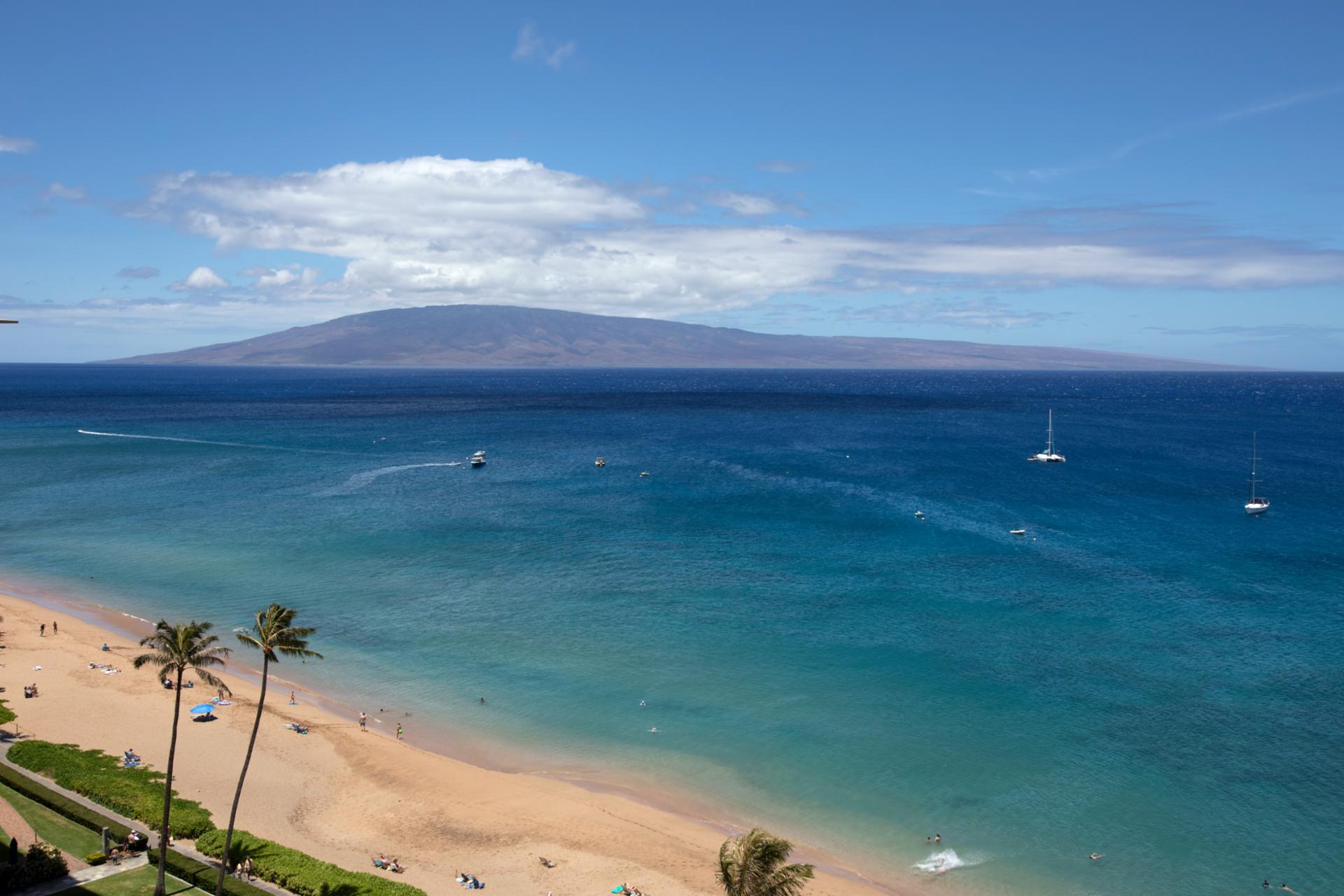Sip something chilled as boats glide by and cloud shadows dance on a sea that stretches into blissful forever.