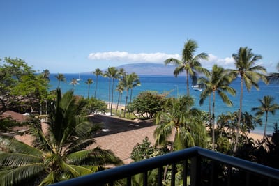 Savor postcard-worthy mornings with palm-framed ocean views and island breezes from your private lanai