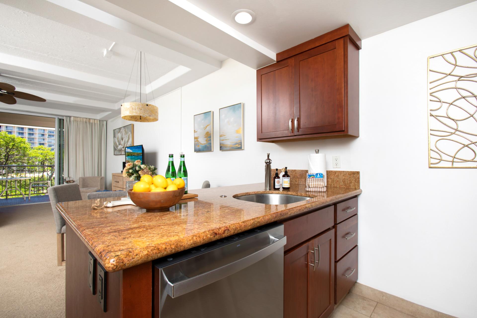 Warm wood, golden granite, and stainless sparkle, this chic kitchen feels like a recipe kissed by island sunshine WH2-661