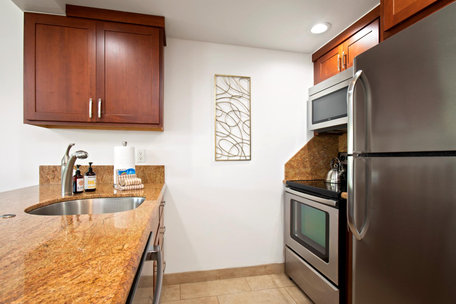 With smooth stone counters and cherry-toned charm, this cozy kitchen stirs up comfort and a hint of wanderlust WH2-661