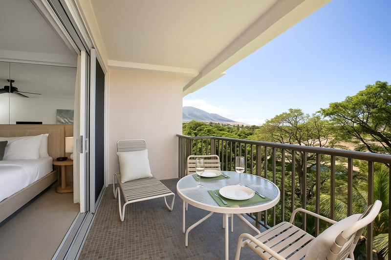 Start your day with fresh island air and a coffee al fresco, where mountain peaks and palms stretch into blue skies
