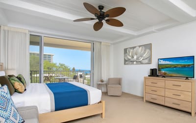 Wake up in this airy, light-filled suite where soft neutrals, local art, and lanai views ease you into island time
