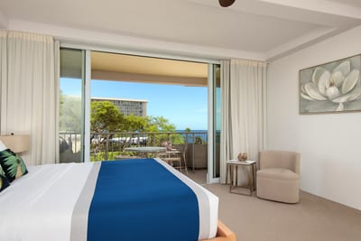 From bold tropical accents to soft garden light, this polished suite hums with comfort and island whimsy
