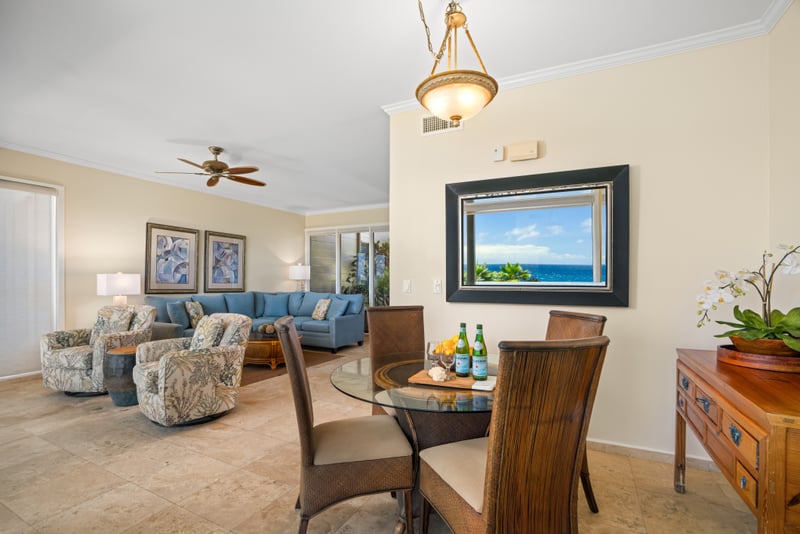 Natural light pours into this coastal-chic space blending indoor comfort with outdoor charm