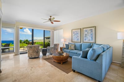 This bright and airy living space offers seamless flow to the lanai and lush surroundings KBV-34G4