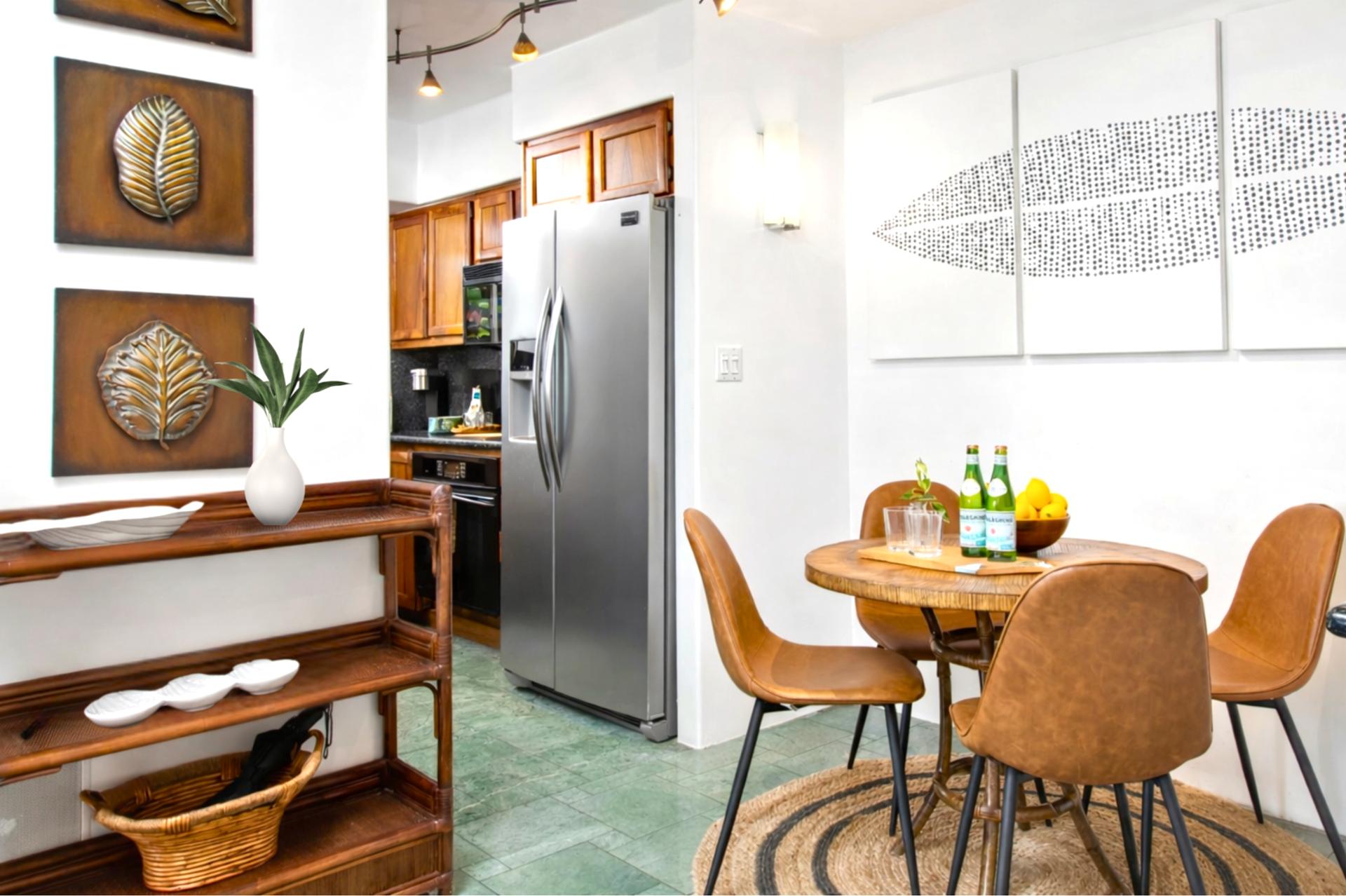 The open-concept dining area features stylish seating and elegant island décor, perfect for enjoying meals with friends and family.
