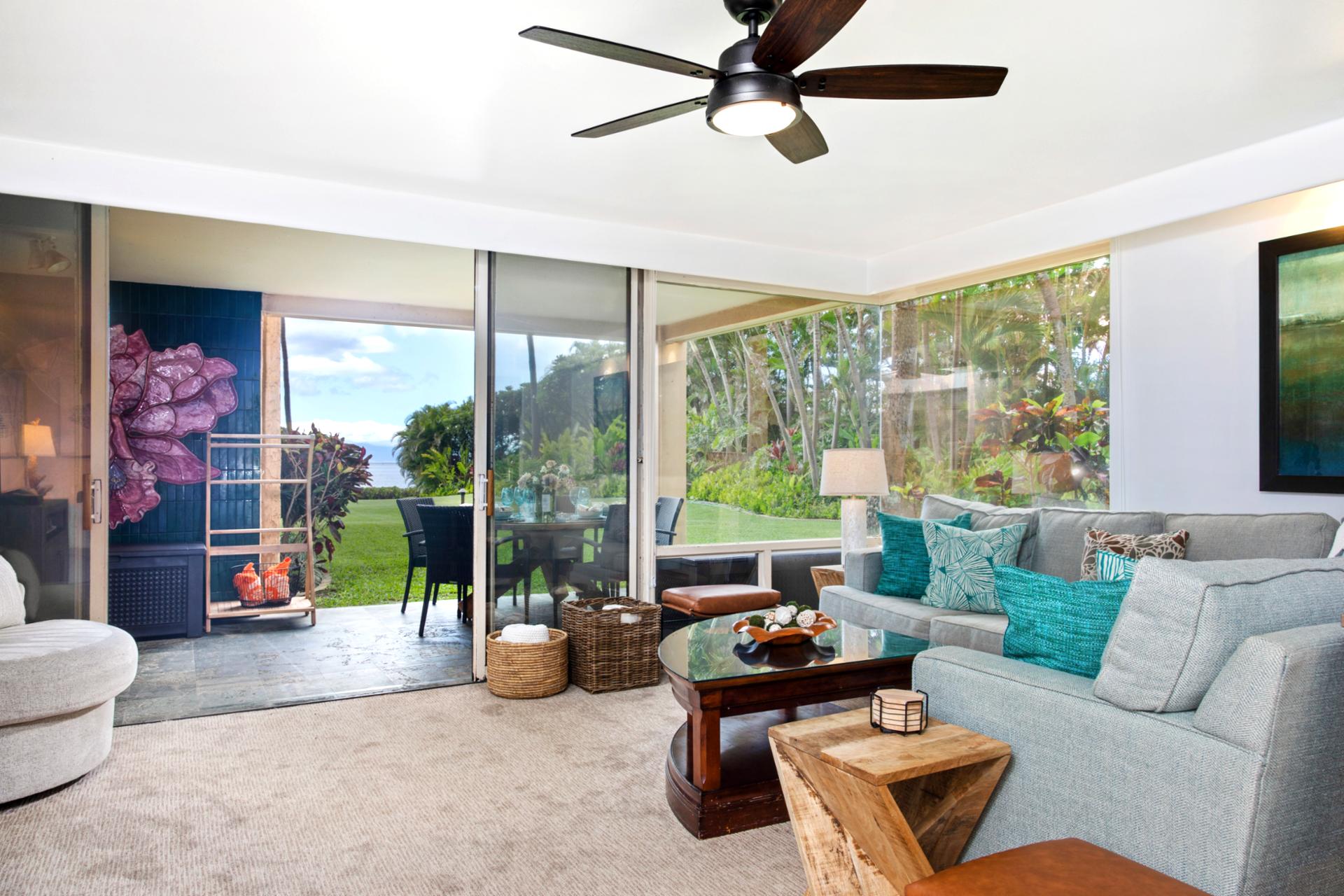 Spacious and light-filled living areas offer plush seating, ceiling fans, and large windows with garden views—ideal for relaxing after a day in the sun.