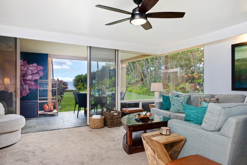 Spacious and light-filled living areas offer plush seating, ceiling fans, and large windows with garden views—ideal for relaxing after a day in the sun.