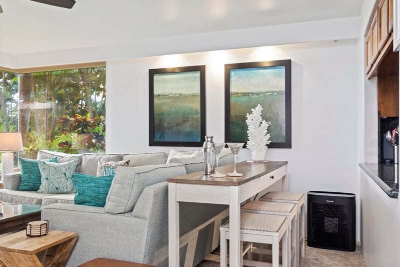Spacious and light-filled living areas offer plush seating, ceiling fans, and large windows with garden views—ideal for relaxing after a day in the sun.