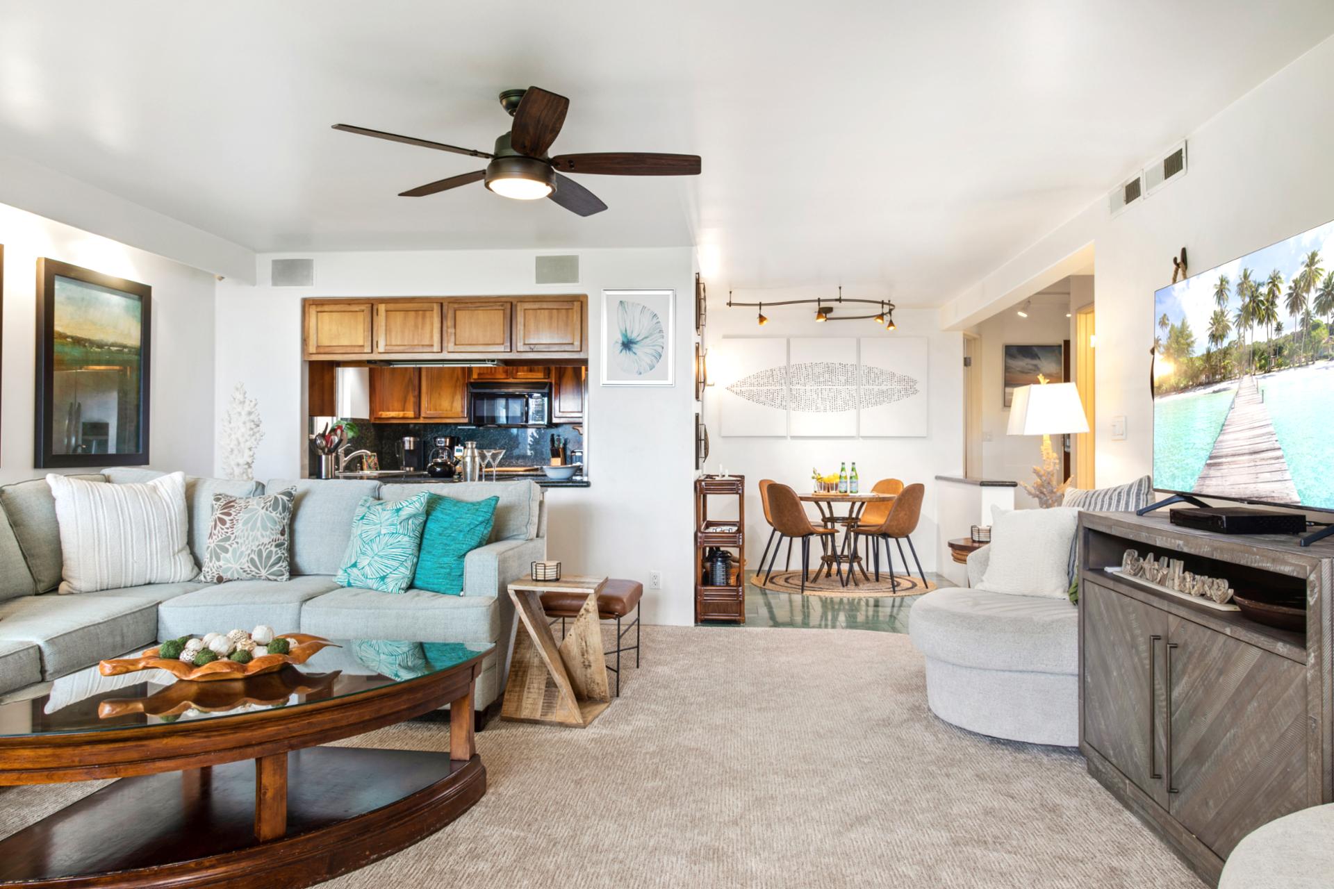 Spacious and light-filled living areas offer plush seating, ceiling fans, and large windows with garden views—ideal for relaxing after a day in the sun.