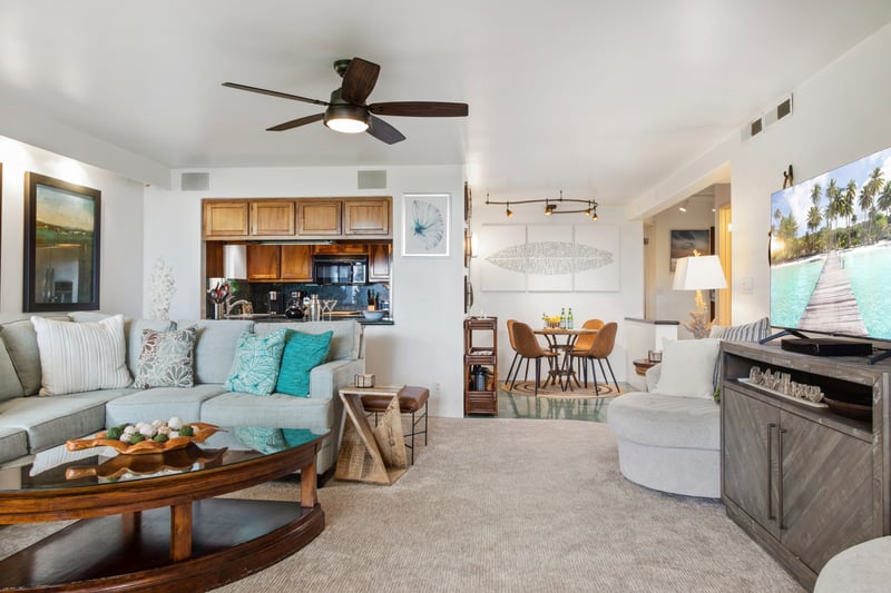 Spacious and light-filled living areas offer plush seating, ceiling fans, and large windows with garden views—ideal for relaxing after a day in the sun.