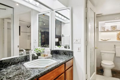 Where mineral hues meet clean design—an understated nook to reset, reflect, and rinse off the day