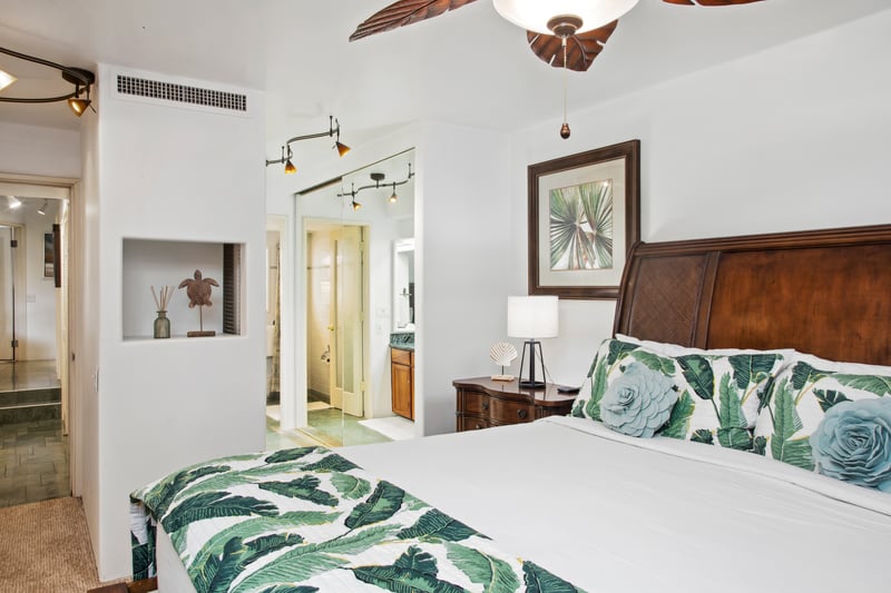 Elegant wood-carved furnishings and natural light-filled space create the perfect sanctuary for restful island nights