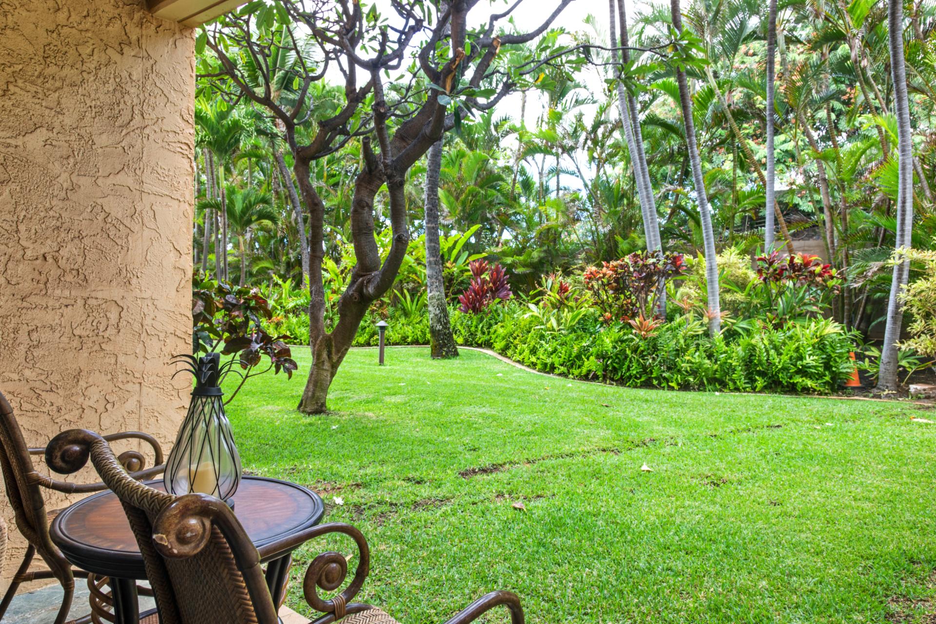 A space that lives between indoors and out—earth-toned walls, cool stone tiles, and the soft sway of palm fronds