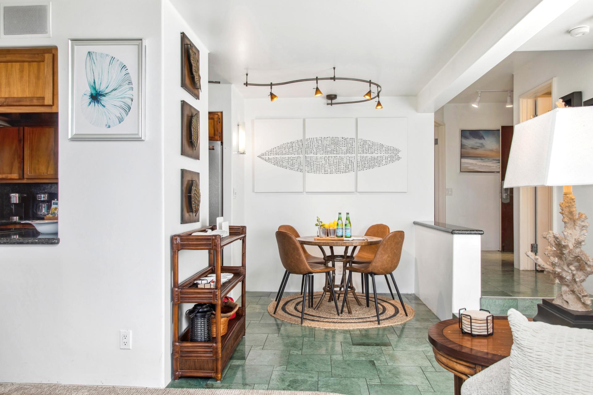 The open-concept dining area features stylish seating and elegant island décor, perfect for enjoying meals with friends and family.

