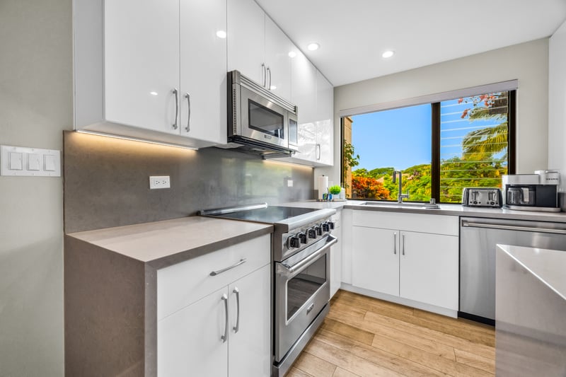 The bright and modern kitchen features up to date appliances making meal prep a breeze