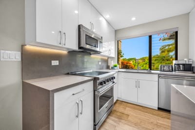The bright and modern kitchen features up to date appliances making meal prep a breeze