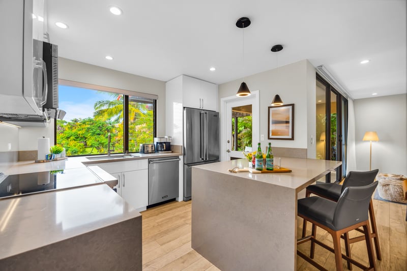Open concept kitchen that flows effortlessly into island living