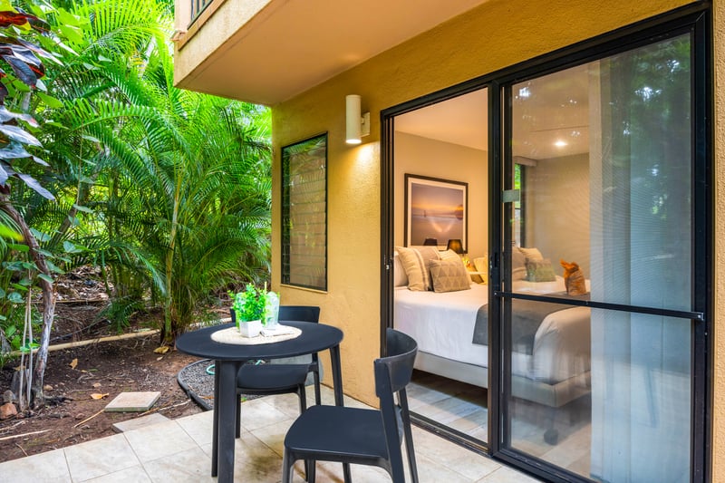 Enjoy your morning coffee surrounded by tropical foliage