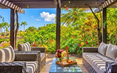 Spacious outdoor seating surrounded by tropical beauty