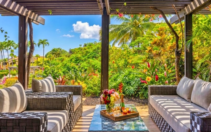 Spacious outdoor seating surrounded by tropical beauty