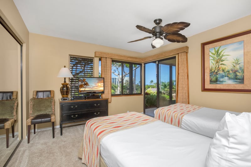 Twin-sized beds stand like sandy little ships, side by side and ready to sail you into island dreams each night