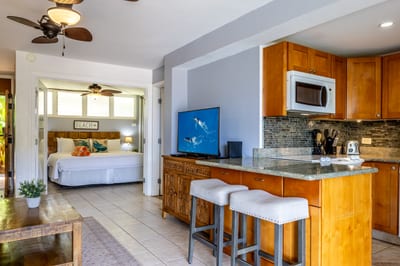 Elegant living room flowing into the tranquil bedroom for a harmonious vacation experience.