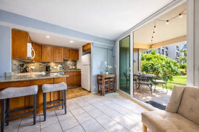 You living area seamlessly connects the living area to the outdoors with large, floor-to-ceiling, sliding doors.
