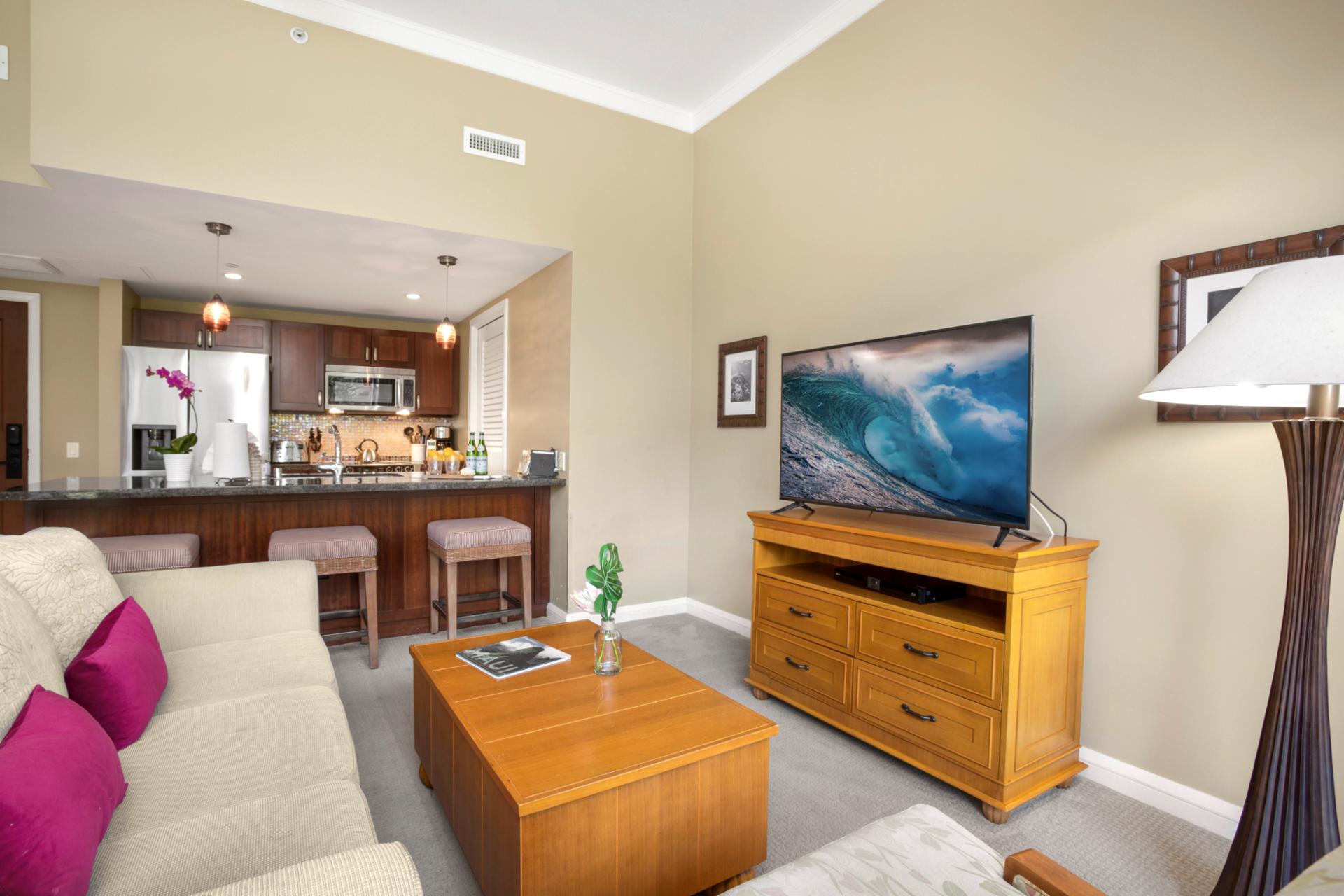 Relax in comfort: modern kitchen, plush seating, and perfect vibes. 