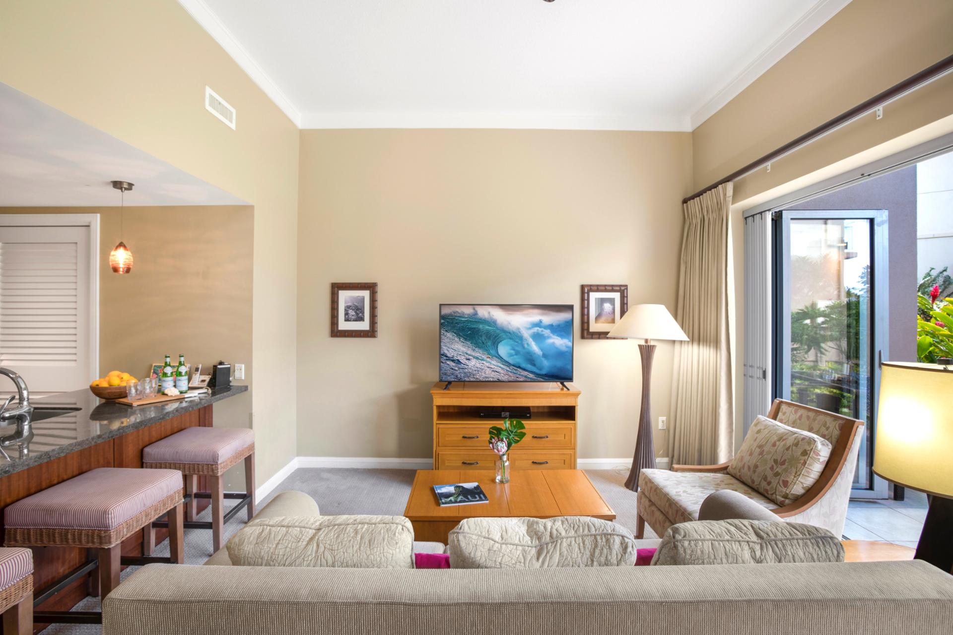 Relax in style with plush sofas, vibrant decor, and a large flat-screen TV—perfect for movie night