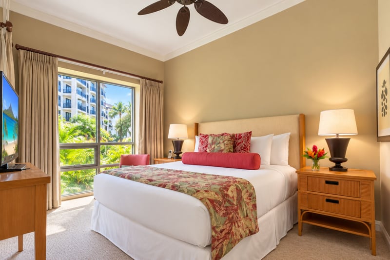 Rest easy in the serene master suite, beautifully appointed with premium linens and warm, inviting decor. HKH-114