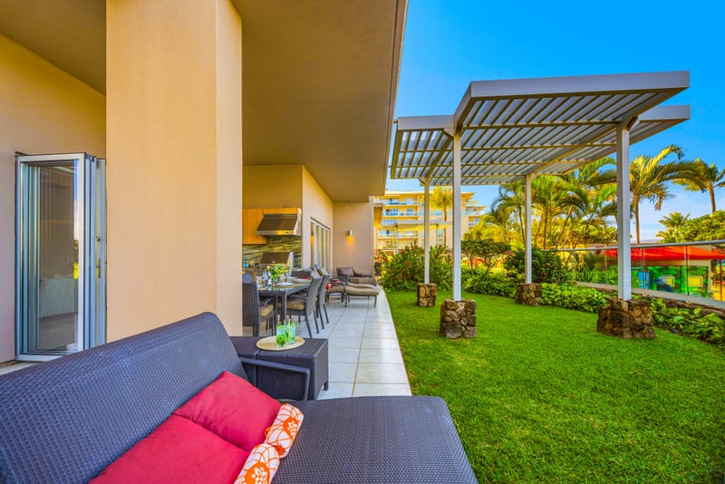 Living room at Honua Kai HKH-150 — direct ocean views through the sliding glass doors
