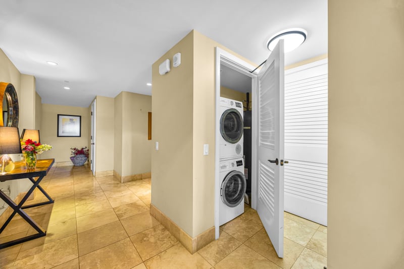 In-unit laundry at Honua Kai Hokulani 150 — full-size stacked washer and dryer for effortless long-stay convenience