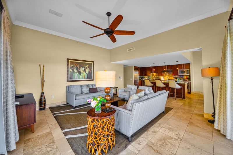 Living room at Honua Kai HKH-150 — wide sightlines through to the kitchen and dining room