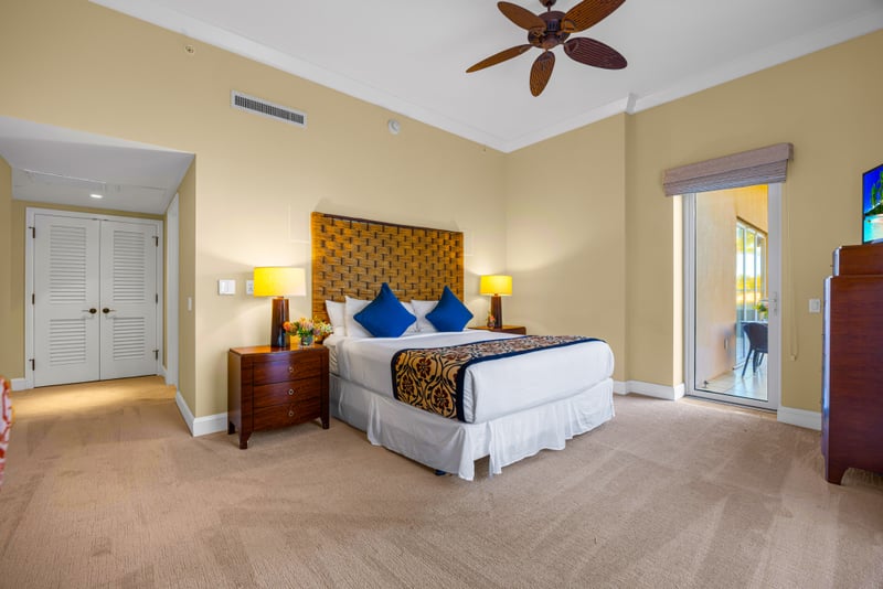 Primary bathroom at Honua Kai HKH-150 — glass walk-in shower and freestanding soaking tub with dual vanity