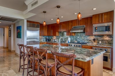 Elevated island living with a stunning open kitchen, bar seating, and a dining space made for sunset gatherings HKH-201