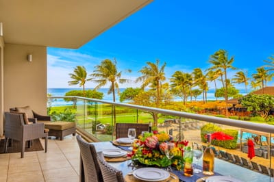 Covered balcony offers a perfect blend of shade and scenery for relaxing or dining al fresco.