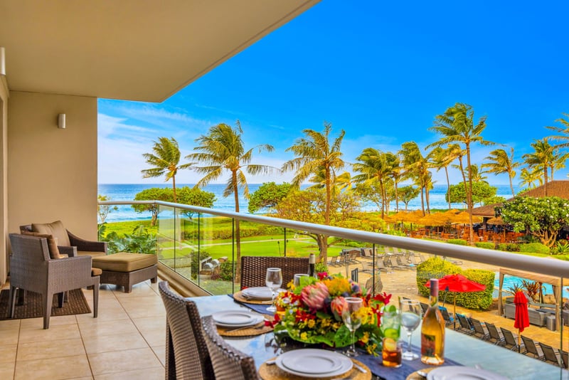 Covered balcony offers a perfect blend of shade and scenery for relaxing or dining al fresco.