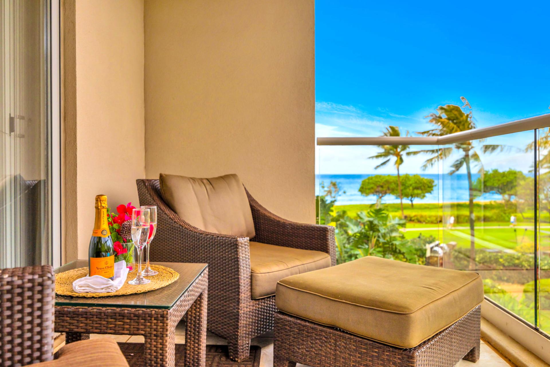 Cozy outdoor seating lets you unwind with peaceful garden and partial ocean views. HKH-203