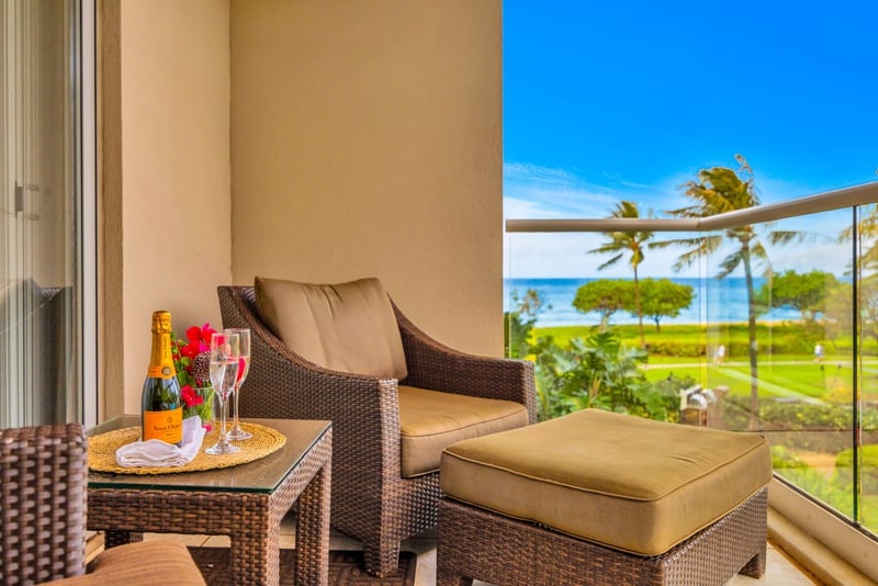 Cozy outdoor seating lets you unwind with peaceful garden and partial ocean views.