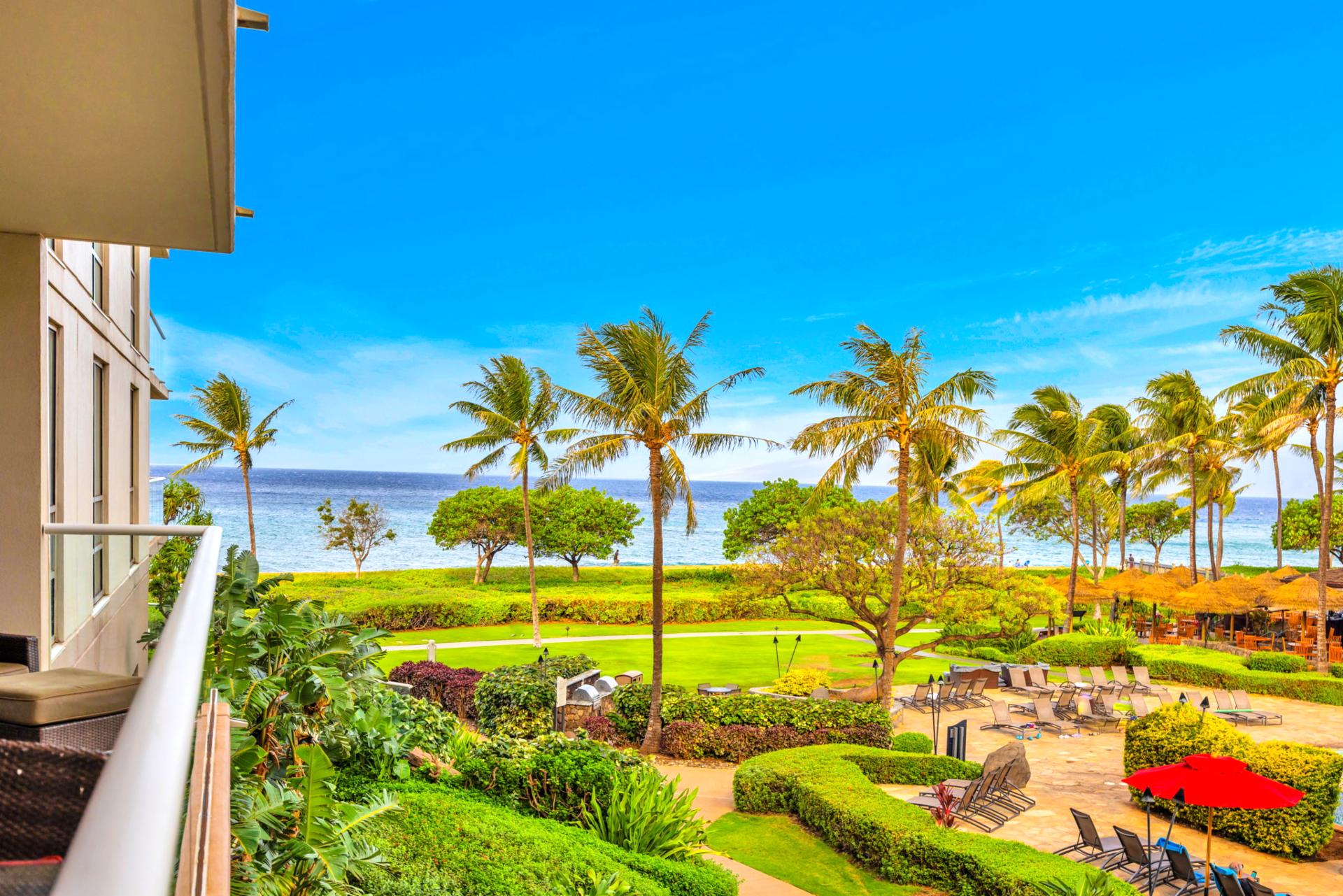 Lush landscaping and a glimpse of the sea set the tone for laid-back island living. HKH-203