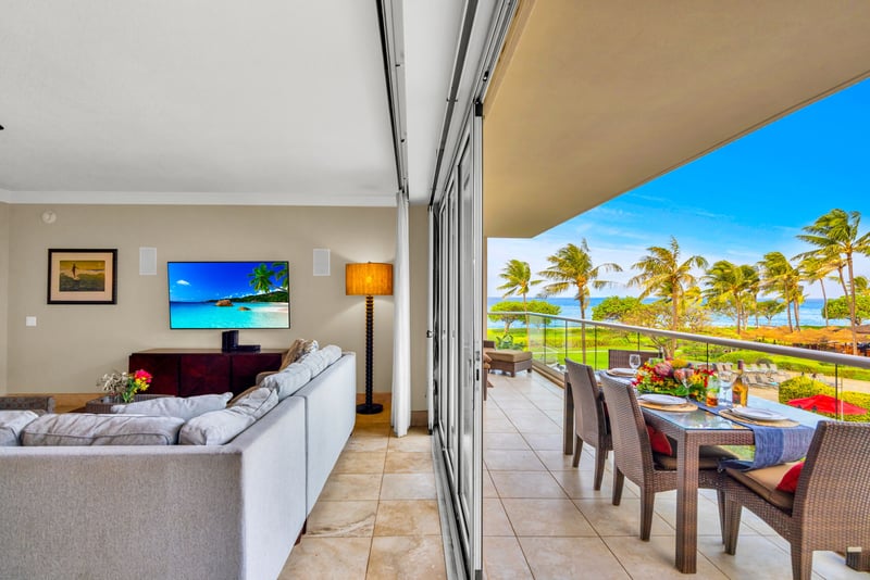 Open-concept living space connects to the balcony, making lounging or entertaining easy and breezy.