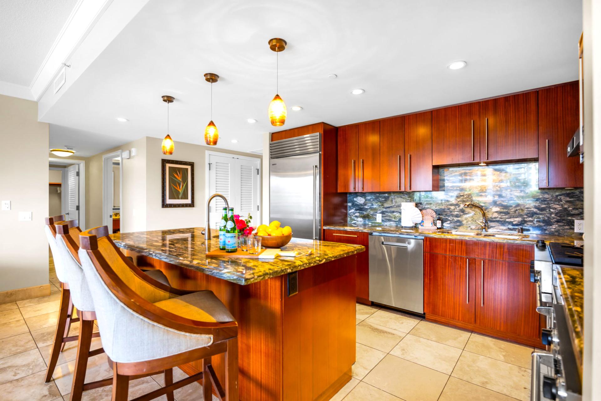 High-end kitchen with ample counter space and bar seating for added convenience. HKH-203