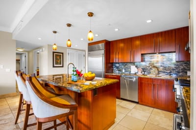 High-end kitchen with ample counter space and bar seating for added convenience.