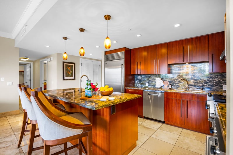 High-end kitchen with ample counter space and bar seating for added convenience.