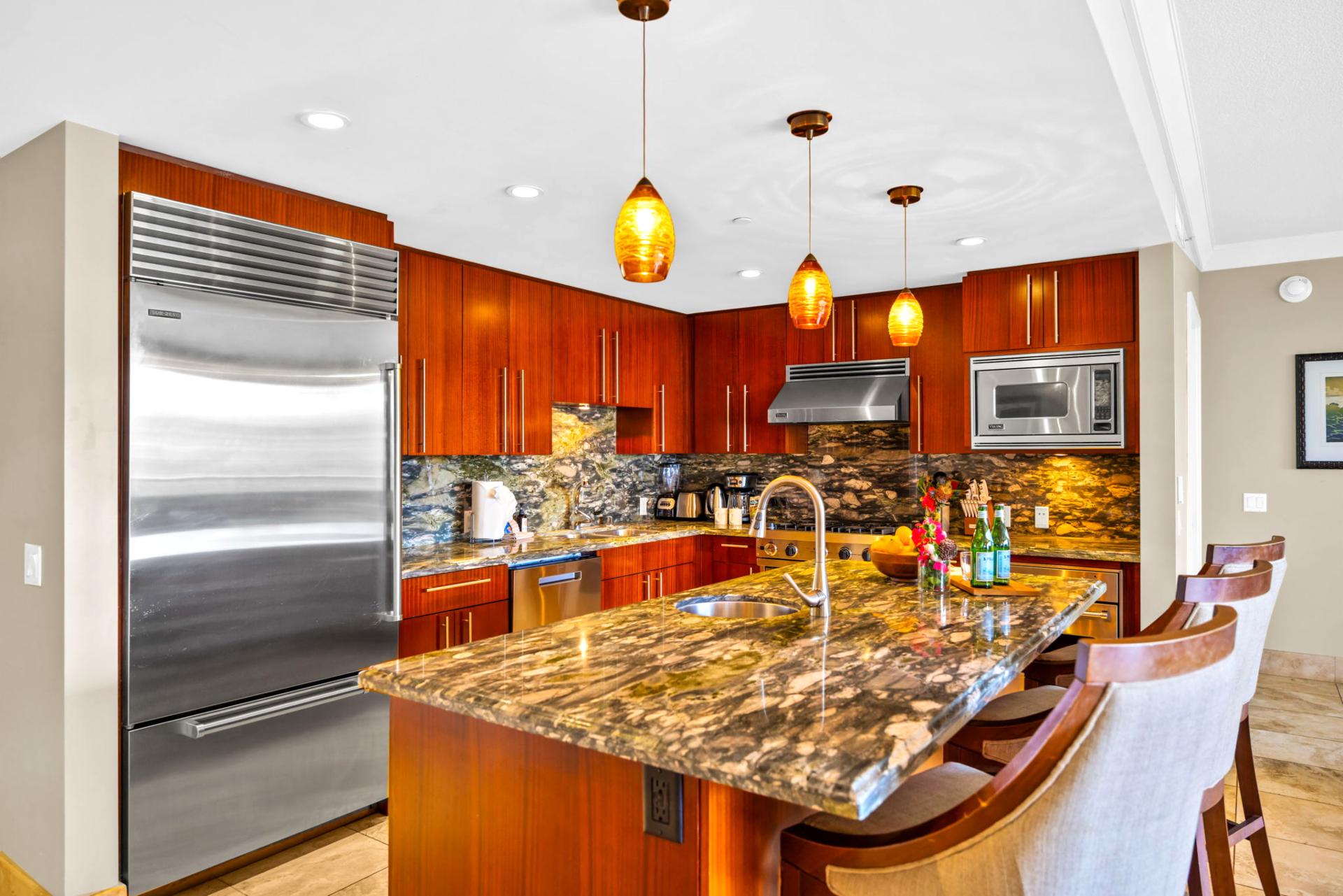 Open kitchen with seating at the island invites casual dining and conversation HKH-203