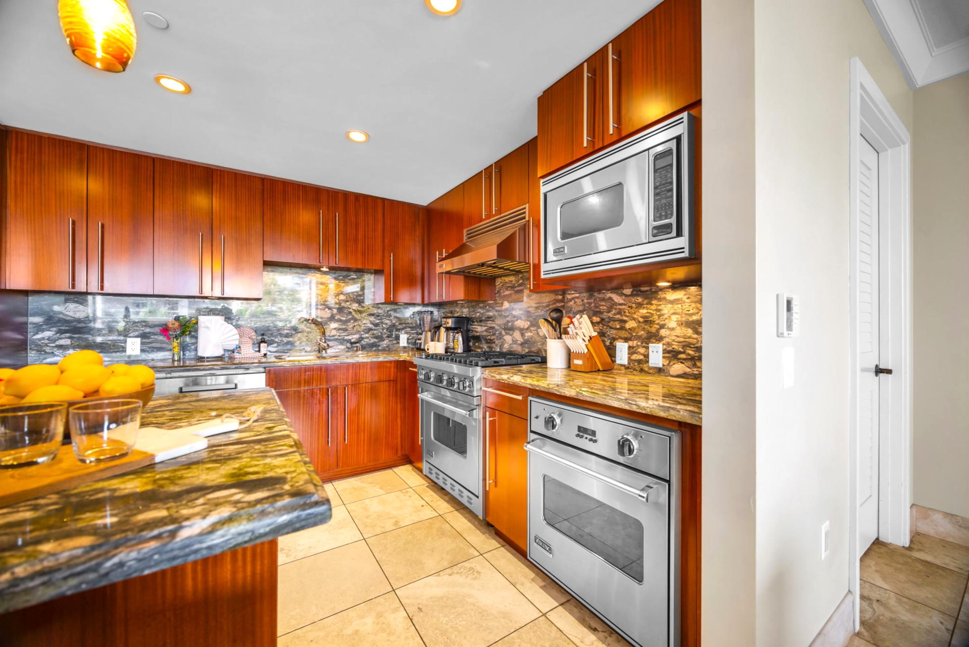 Modern kitchen design with gas range and sleek finishes adds both style and function. HKH-203