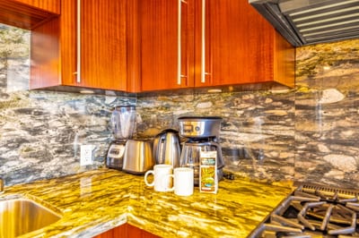 Granite counters and coffee essentials for a smooth start to your mornings.
